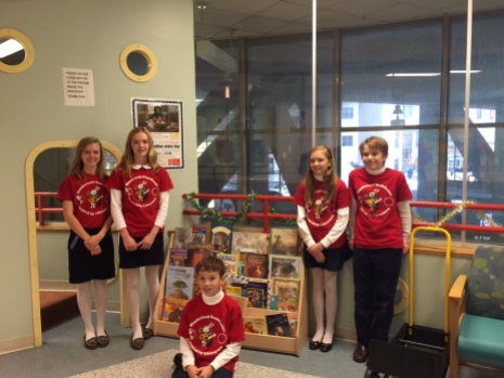 posing with some of our books donated to Tufts Floating Hospital for Children